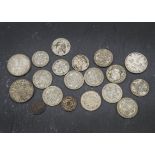 A collection of British coins, including a 1935 and 1937 crown, other crowns, a selection of pre-