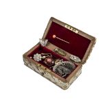 An Edwardian period snake skin covered jewellery casket, containing a gold and coral bead stick pin,