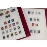 A collection of British stamps, presented in four red SG folders with inserts, not complete, some