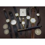 A collection of watches and coins, including a small 9ct gold cased lady's Seiko, a gents Sekonda,