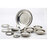 Eleven vintage Middle Eastern silver and white metal items, including a circular tray, a set of four
