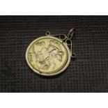 A George V half sovereign in pendant mount, the 9ct gold circular mount with 1914 dated coin, 5.2g