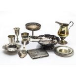 A collection of 19th and 20th century silver, including a pair of Victorian sugar tongs, a cream