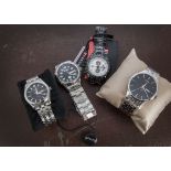 A group of eight modern wristwatches, all in very good condition and appear unworn, including