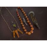 A collection of jewellery, including a carnelian bead necklace, a boxed white metal necklace,