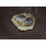 A pair late 19th century oval moss agate panels, 2cm, together with an opal pebble, 4.5cm (3)