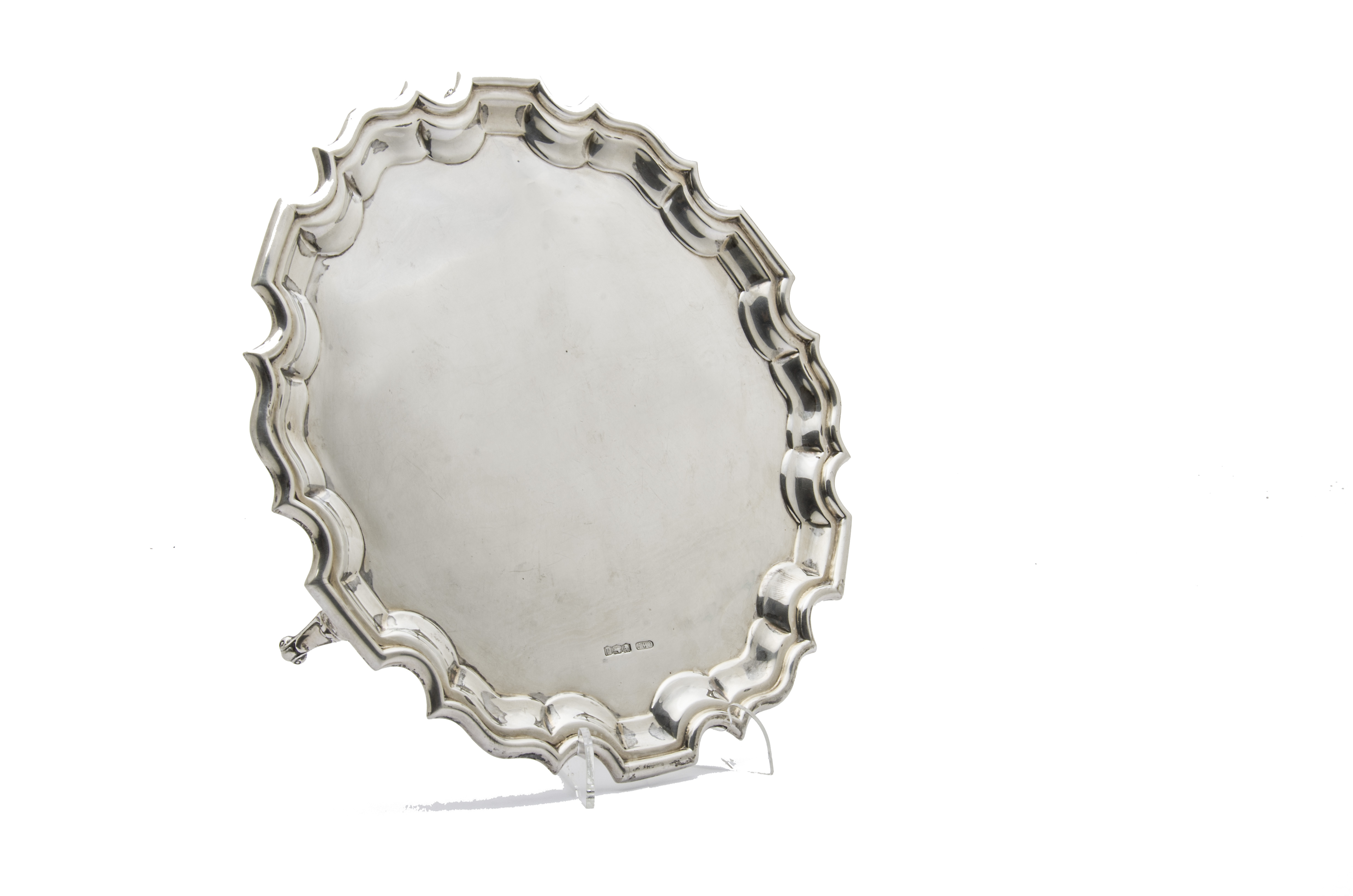 A George V silver salver from CWF, pie crust rim on three supports, Sheffield 1921, 24 ozt