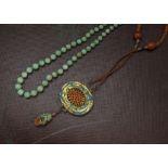 A vintage Chinese green hardstone bead necklace, similar to jade, 40cm, together with a fine Chinese