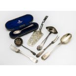 A collection of Victorian and later silver and white metal items of flatware, including a