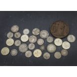 A collection of coins, including an 1887 florin, VF-EF, a 1944 Canada 50 cents, F-VF, some pre-