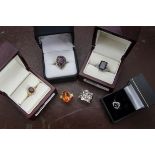 A collection of twelve modern silver and other gem set dress rings, varying styles and stones,