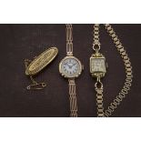 An Art Deco 9ct gold cased lady's wristwatch, on a 9ct gold gatelink bracelet with leather strap,