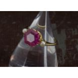 A vintage pink tourmaline and pearl dress ring, the hexagonal cut stone with small white pearl to