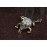 A vintage gold and gem set frog pendant, set with opals, central example cracked, green stones and