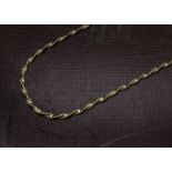 A 1980s 18ct gold necklace, the two tone colour twisted link chain marked 750, 9.8g