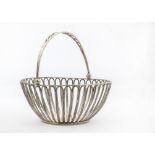 A George III silver bread basket by IT, pierced sides to circular bowl with swing handle, London