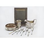 A George III silver milk jug and other silver items, including a photograph frame, a Christening