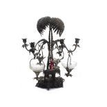 An impressive Victorian silver plated table centre piece, the base with three elephant heads