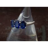 A modern 9ct white gold and three stone kyanite dress ring, 3.2g and size N