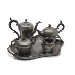 A Victorian pewter tea set by Broadhead & Atkin, comprising tray, teapot, hot water, sucrier and