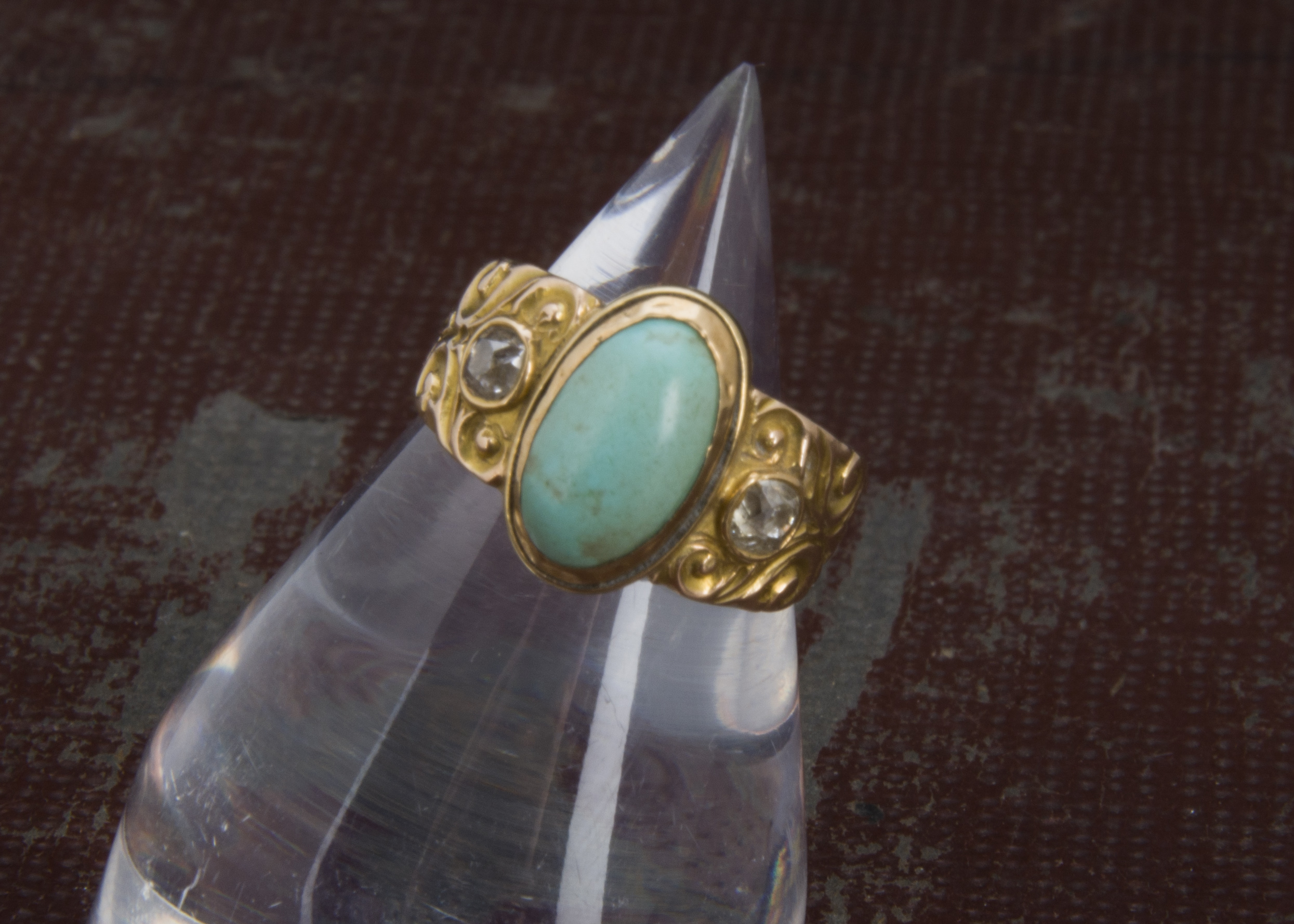 A Victorian gold turquoise and diamond three stone ring, the thick tapering band engraved to