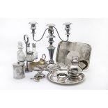 A collection of silver plated items, including a Middle Eastern footed dish, a glass cruet set on