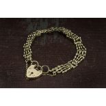 A 9ct gold bracelet, gatelink style with heart shaped padlock clasp, hallmarked, 19.2g