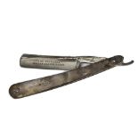 A late Victorian silver handled cut throat razor, dated Sheffield 1897, with card case (2)