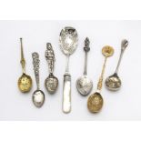 A large collection of silver and silver plated teapsoons, including many souvenir examples, a