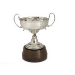 A George V silver twin handled trophy cup by RC, stylish ear shaped handled with engraved