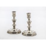 A pair of 1970s silver filled Georgian style candlesticks one is slightly bent