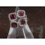 A modern 18ct white gold and four stone ruby dress ring, the diamond encrusted tablet and