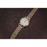 A 1950s 9ct gold Longines gentleman's wristwatch, circular case and dial, baton and Arabic numerals,