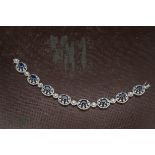 A modern pretty 18ct white gold sapphire and diamond bracelet, having eight sapphire and diamond