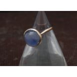 An early 20th century gold solitaire ring, having cabochon moonstone or chalcedony, 3g and size J