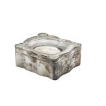 An Edwardian silver small jewellery casket, the shaped hinged box with lift out tray