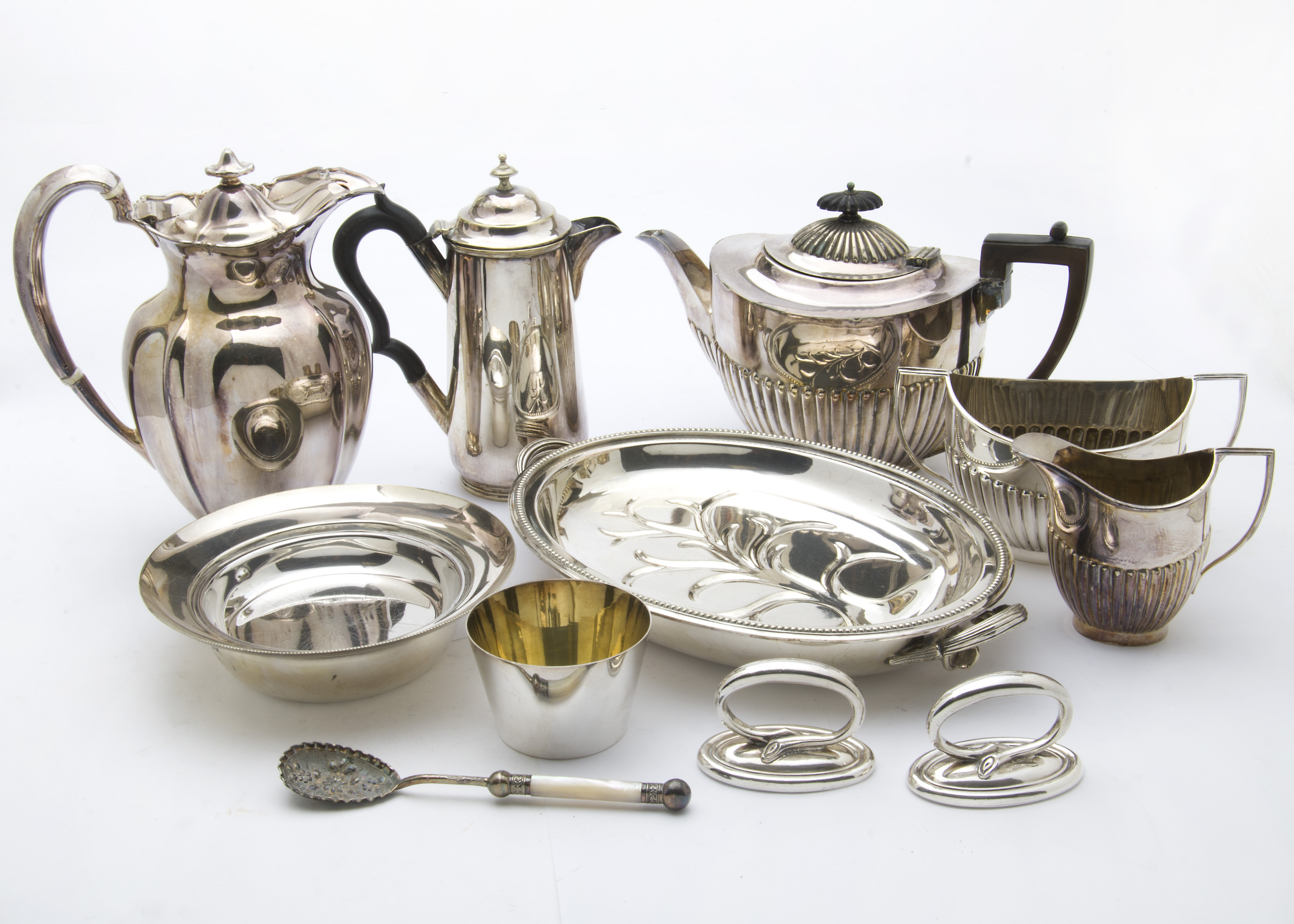 A collection of Georgian and later silver plate, including a Victorian carved ivory handle crumb