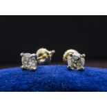 A pair of modern certified diamond stud earrings, in 14ct marked mounts, each 0.5ct, with IGL