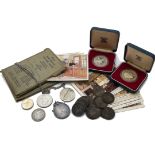 A collection of coins and other items, including several proof like silver coins in cases, a