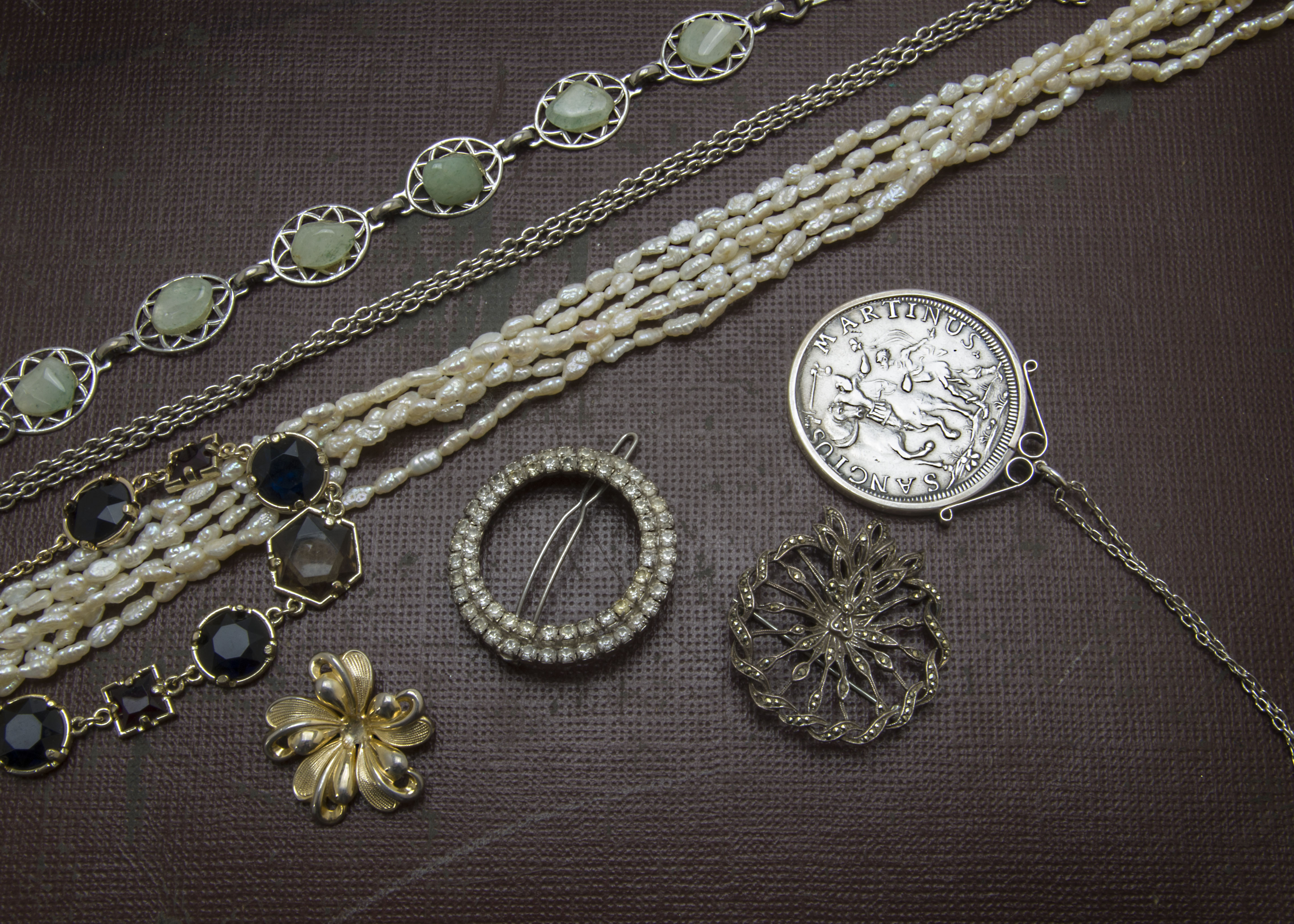A collection of jewellery and jewellery boxes, including silver jewellery such as a brooch with