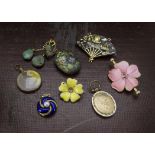 A group of eight antique and vintage pendants and brooches, including a pretty silver gilt and