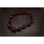An Art Deco period Bakelite cherry amber style bead necklace