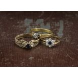 Two 9ct gold and gem set rings, 4g, together with a gold and diamond solitaire ring, 2.7g (3)