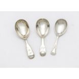 A group of three silver tea caddy spoons, including two Victorian examples, one fiddle and thread