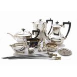 A collection of silver and silver plated items, including a silver wine bottle coaster, a pair of