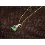 An 18ct gold emerald and diamond pendant, on a fine box link 18ct gold chain, 3.2g