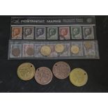 A collection of world coins, large quantity in a tin, together with four ceramic pipe maker tags,