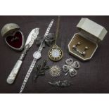 A collection of jewellery and other items, including a silver bangle, several silver items of