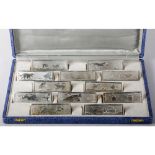 Boxed Set of Twelve French Silver Metal Knife Rests, each embossed with images of animals from Les