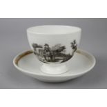 A White Bone China Cup and Saucer with a Lithographed Image of a Peepshow on the Side of the Cup,